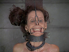 Skinny milf having her pussy pegged in BDSM torture